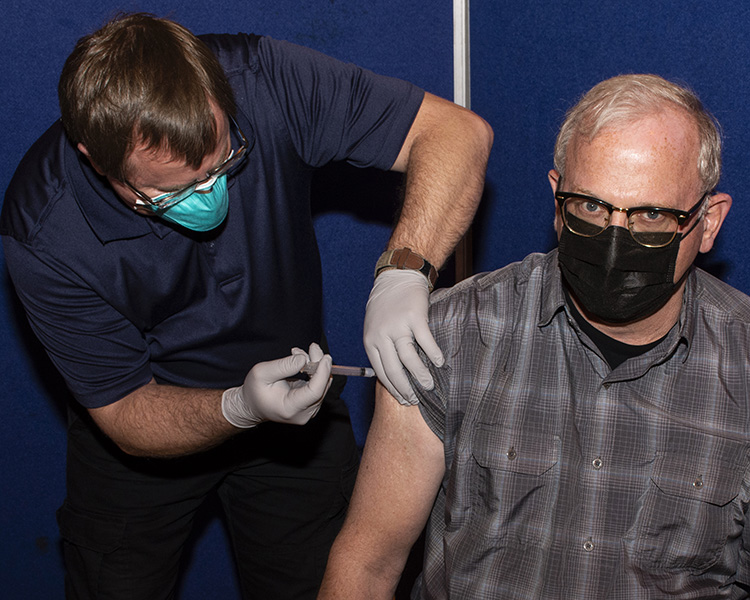 Wendell Williams, a program manager for Special Programs Division, receives a COVID-19 coronavirus immunization March 23, 2021 at Dugway Proving Ground. Civilian and Army medical personnel from the Dugway Health Clinic, a tenant unit from Fort Carson, Colorado, have been giving the inoculations all along. Photo by Al Vogel, Dugway Public Affairs