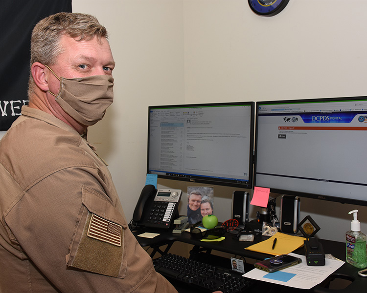 John Pierce, Deputy Chief of Security Division, wears a dust mask that Security officers have been wearing at times. Security does not have much interaction with the public, unlike Law Enforcement, he said. When driving they do not wear their mask, but do so when in public or among other officers. Photo by Al Vogel, Dugway Public Affairs.