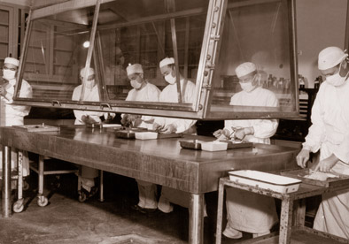 Historical image from around the 1950s of biological scientists performing dissections in Dugway biological laboratory facilities