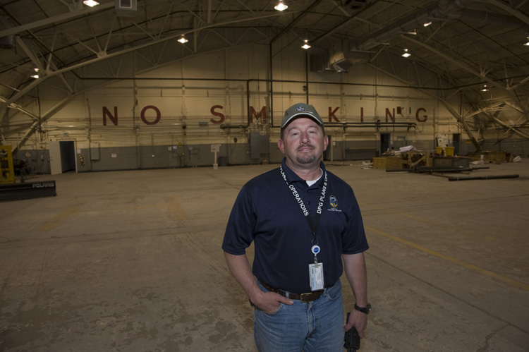 David Rhyne, manager for Michael Army Airfield, is understandably pleased that the 1940s hangar is being refurbished. Its cavernous bay will offer plenty of room to house and work on aircraft.