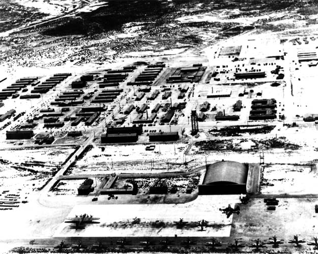 Hangar No. 1 in 1950, with what appears to be a B25 bomber and P51 Mustang fighters parked before it.