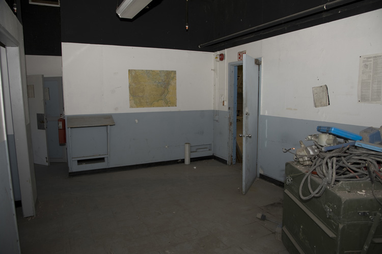 An unused office behind the bay wall at the south end of the hangar. Installation Management Command plans to refurbish Hangar No. 1‘s offices in 2015. These offices were probably last refurbished in the 1960s or 1970s.