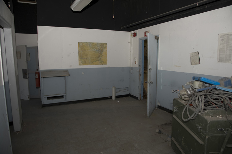 An unused office behind the bay wall at the south end of the hangar. Installation Management Command plans to refurbish Hangar No. 1s offices in 2015. These offices were probably last refurbished in the 1960s or 1970s.