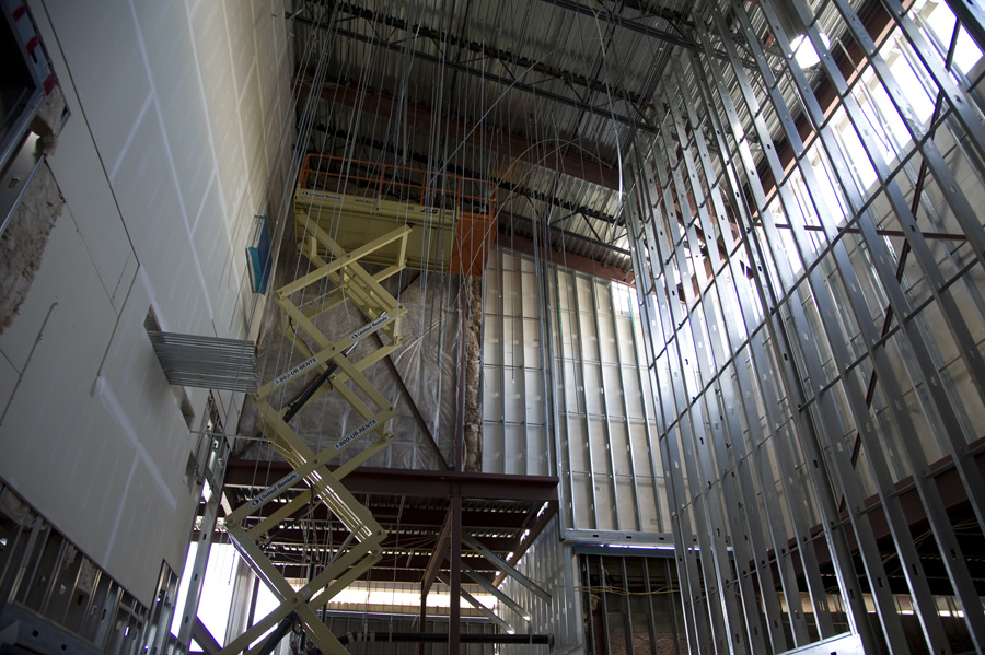 Inside, dozens of bolts hang from the ceiling that will support the massive and sophisticated ventilation system. When completed, the building will be sealed and have negative pressure, to draw all atmosphere to central points for filtering, before return outdoors.