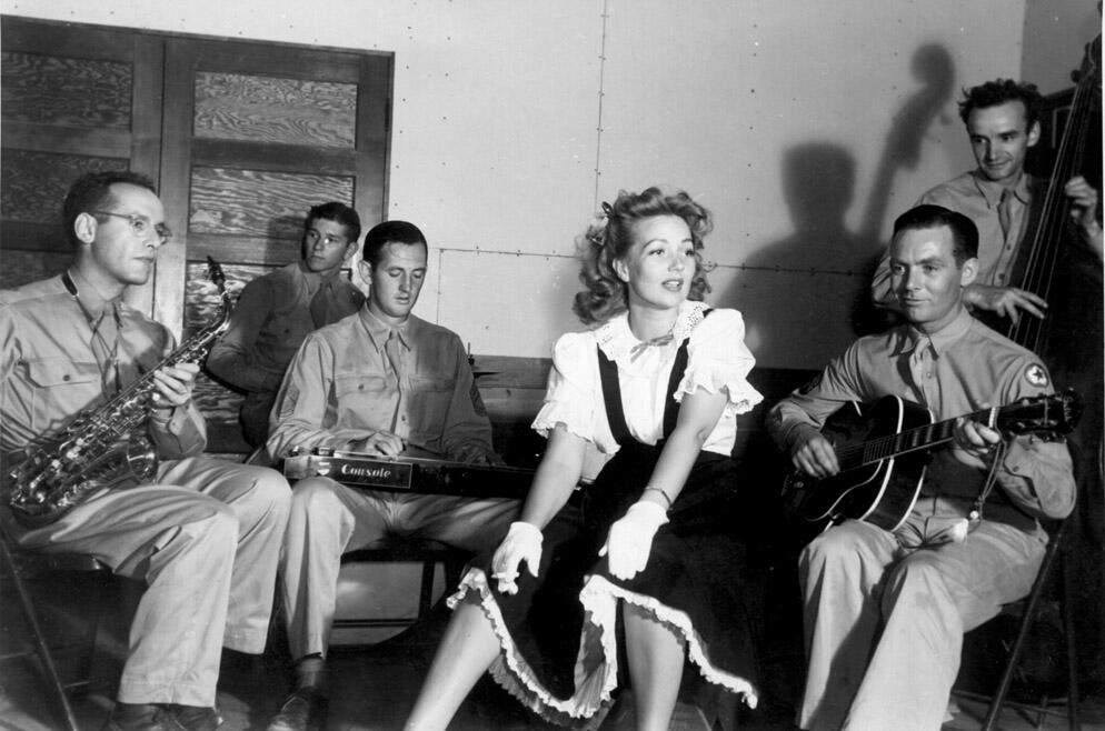 Even a post as remote as Dugway Proving Ground in the 1940s got a visit from a famous Hollywood star. Ann Sothern entertains the troops with song, though she was also a fine actress. Ann‘s last movie was in 1987, for which she was nominated for an Oscar. She died in 2001 in Ketchum, Idaho.