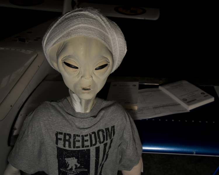 Some photos show people posing with an 'Alien'. The mannequin (alienquin?) was borrowed from Dugway‘s Community Club as a humorous prop. Demand to have your photo taken beside it was high.