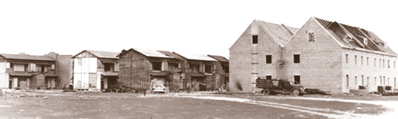 Two-storey Japanese Village buildings and the taller brick German Village duplex designed during World War II for the testing of incendiary bombs and devices at Dugway