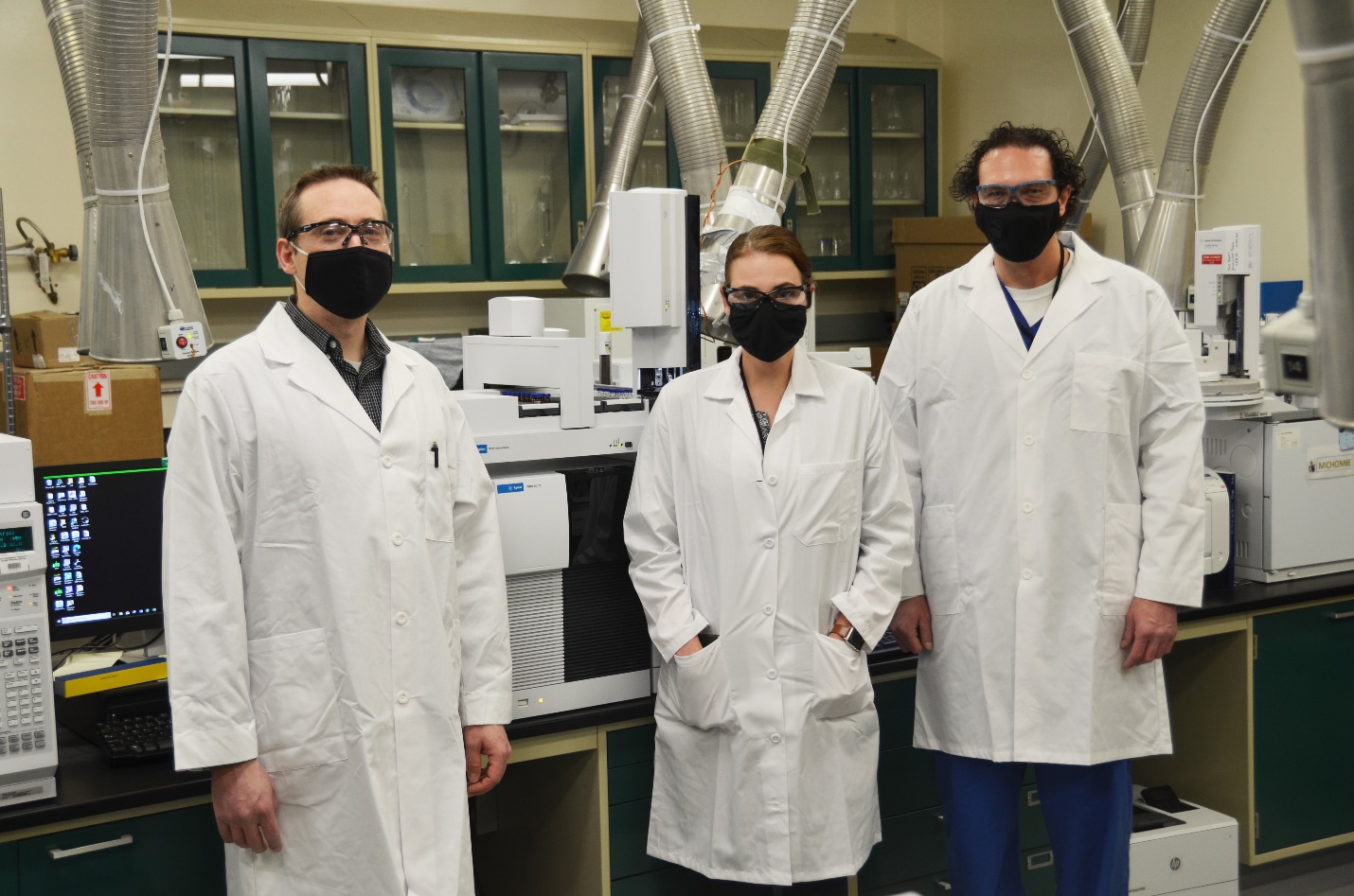 Chemists (pictured from left) Jeremy Jex, Hannah Line and Travis Losser with the Chemical Test Division’s Chemical Analytical Branch stand in front of a GC-QQQ, a highly sensitive instrument that they proved can be used to analyze chemical warfare agents. Their supervisor, Dr. Richard Phan (not pictured), provided support during the process and fellow colleagues Judy Fox, Rebecca Mine and Alexander Grimaldi contributed to the project. The group will present their findings during a virtual technical conference in early March. Photo by Becki Bryant, Dugway Public Affairs.