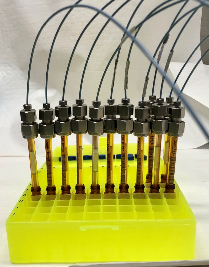 The solid sorbent tubes are placed into a vial at one end and a pump system at the other end. The solvent from up to 12 tubes can be extracted at one time. For the study, the agent was extracted at a rate of 0.25mL/minute for four minutes. Photo courtesy of Chemical Analytical Branch, West Desert Test Center.