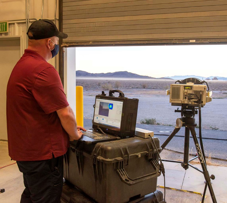 James Berry, DPG Lead Physical Scientist, adjusts the Infrared Hyperspectral Imaging System, a versatile system that enables detection and characterization of simulant chemical vapors (chemical plumes) in an operational, threat-realistic environment. The Hyperspectral Imaging System is a key TECFT test fixture. Photo by Mario Sandoval, Dugway Scientific & Technical Photographer.