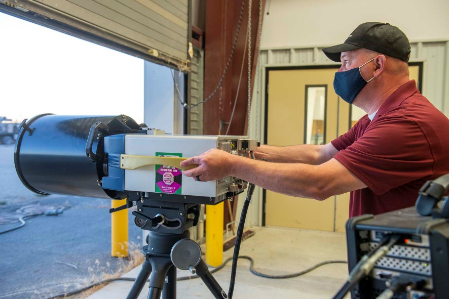 James Berry, DPG Lead Physical Scientist, adjusts the Infrared Hyperspectral Imaging System, a versatile system that enables detection and characterization of simulant chemical vapors (chemical plumes) in an operational, threat-realistic environment. The Hyperspectral Imaging System is a key TECFT test fixture.