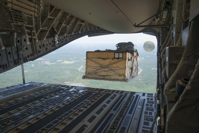 Airdrop Repair Kit Forward Area Supply Box (FASBOX) being extracted from a U.S. Air Force C-17 aircraft during airdrop certification testing over Sicily Drop Zone, Fort Bragg, N.C.  (Photo Credit: Barry Fischer, Audio Visual Production Specialist, Airborne and Special Operations Test Directorate, U.S. Army Operational Test Command)