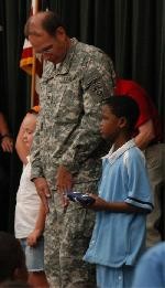 COL Adams presenting American flag