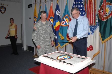 Technical Director cutting the cake