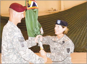 Col. Laura J. Richardson receives unit guidon from Col. Marshall A. Hagen