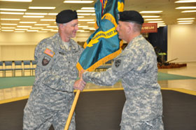 Col. Dave Wellons accepts the colors from Sgt. Maj. James Cook at ITED activation ceremony