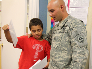 Sgt. 1st Class Kevin Palumbo with son