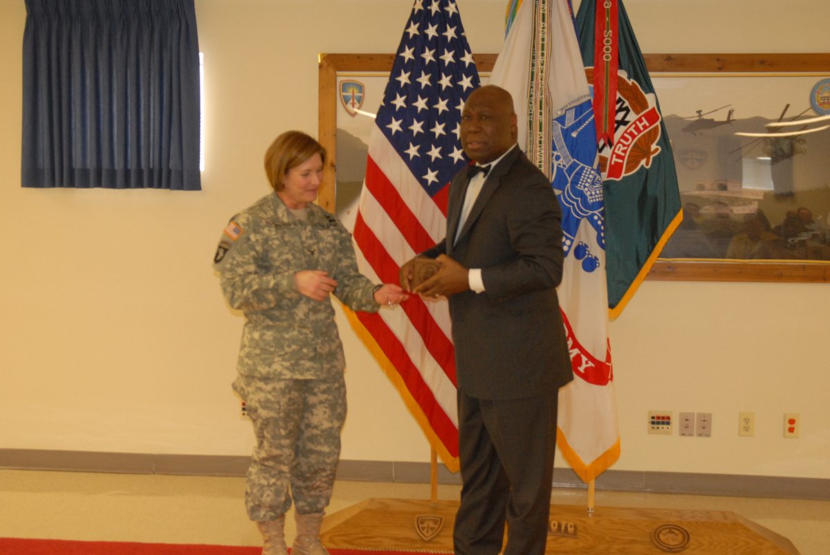 COL Richardson presents coin to Michael Williams