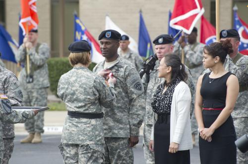 BG Laura Richardson affixes Distinguished Service Medal on outgoing CSM Michael Bobbs uniform