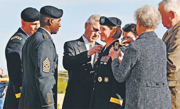 BG Laura J. Richardson accepts one-star insignia