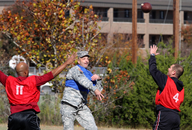 Brig. Gen. Scott Spellmon throws ball during Holiday Bowl game