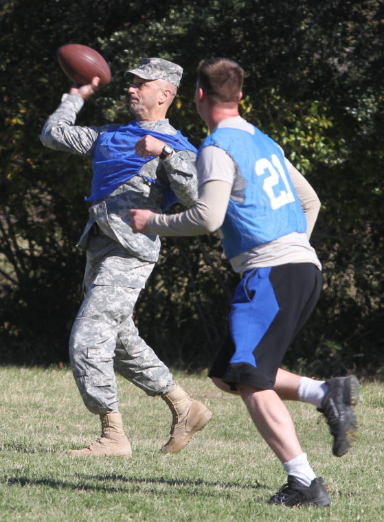 Brig. Gen. Scott Spellmon throws ball during Holiday Bowl game