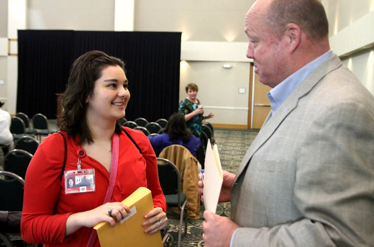 Emily Cumming talks with City Manager Glenn Morrison