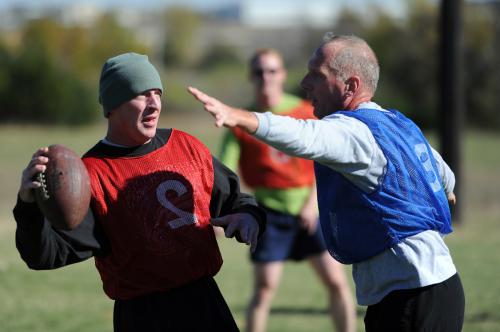 Master Sgt. Troy Willey leans back before throw