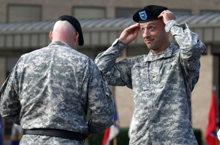 Newly promoted Brig. Gen. Scott A. Spellmon puts on his beret after receiving the brigadier general star