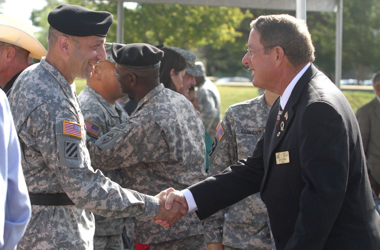 Brig. Gen. Scott A. Spellmon shakes hands with Mayor Dan Corbin