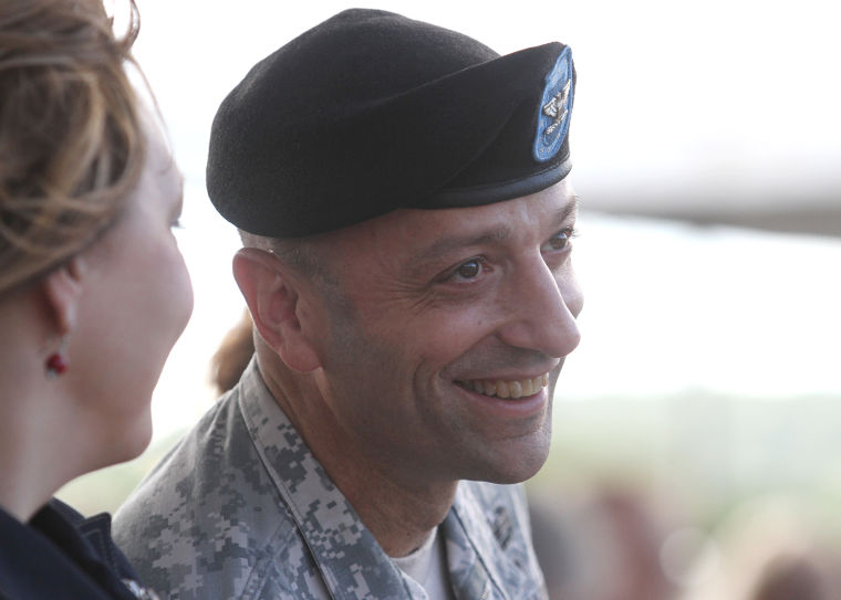 Brig. Gen. Scott A. Spellmon smiles during Maj. Gen. Bryan G. Watson's speech