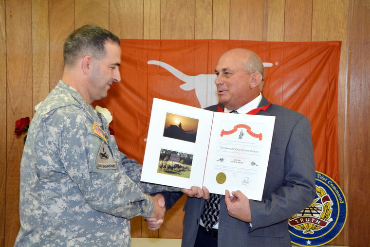 Col. Dennis pastore presents St. Barbara award to Dr. David Brant