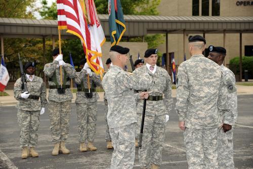 Command Sgt. Maj. Kenneth Graham holds noncommissioned officers sword during ceremony