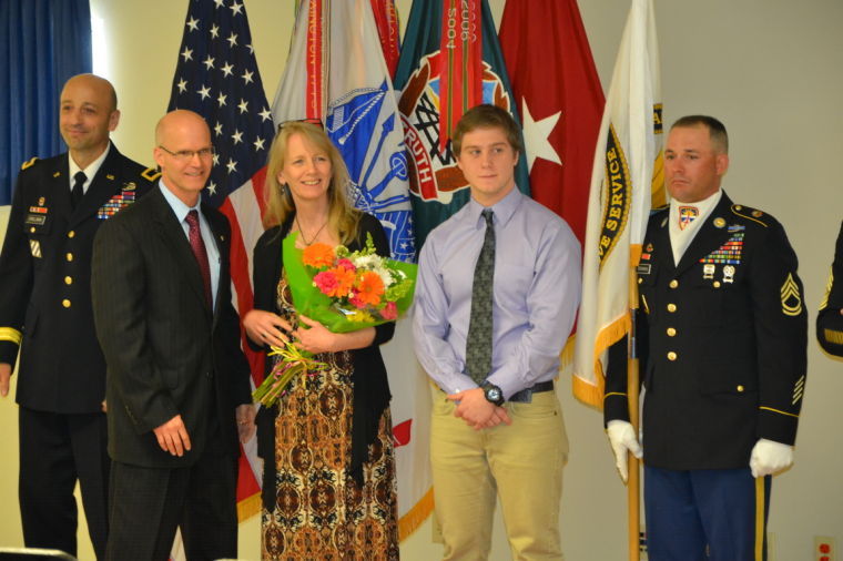 The Miele family stands during promotion ceremony