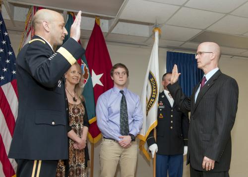 Brig. Gen. Scott Spellmon administers the oath of office to Robert Miele