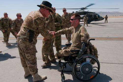 Maj. Gen. Michael Bills greets retired Sgt. Adam Keys