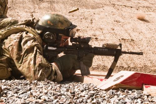 Retired Master Sgt. Christopher Corbin fires M-4 rifle at firing range