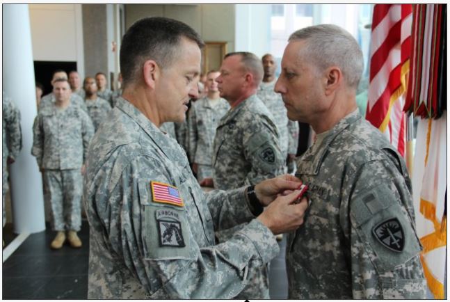 Gen. Daniel B. Allyn presents Maj. Gen. Peter D. Utley with Distinguished Service Medal