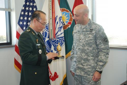 Brig. Gen. Euiseong Lee presents ROKA friendship token to Brig. Gen. Scott Spellmon