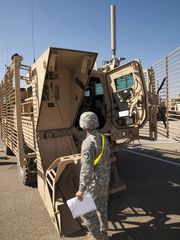 Soldier inspects Robot Deployment System