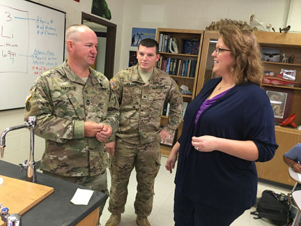 Master Sgt. Earnest Vance (left) and Sgt. Jacob Wilson are greeted by Monica Mitchell (photo by Michael Novogradac, OTC Public Affairs)