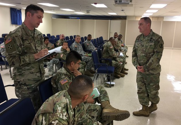 Master Sgt. Jason S. Mikan (left) asks a question to Command Sgt. Maj. David S. Davenport, Sr.