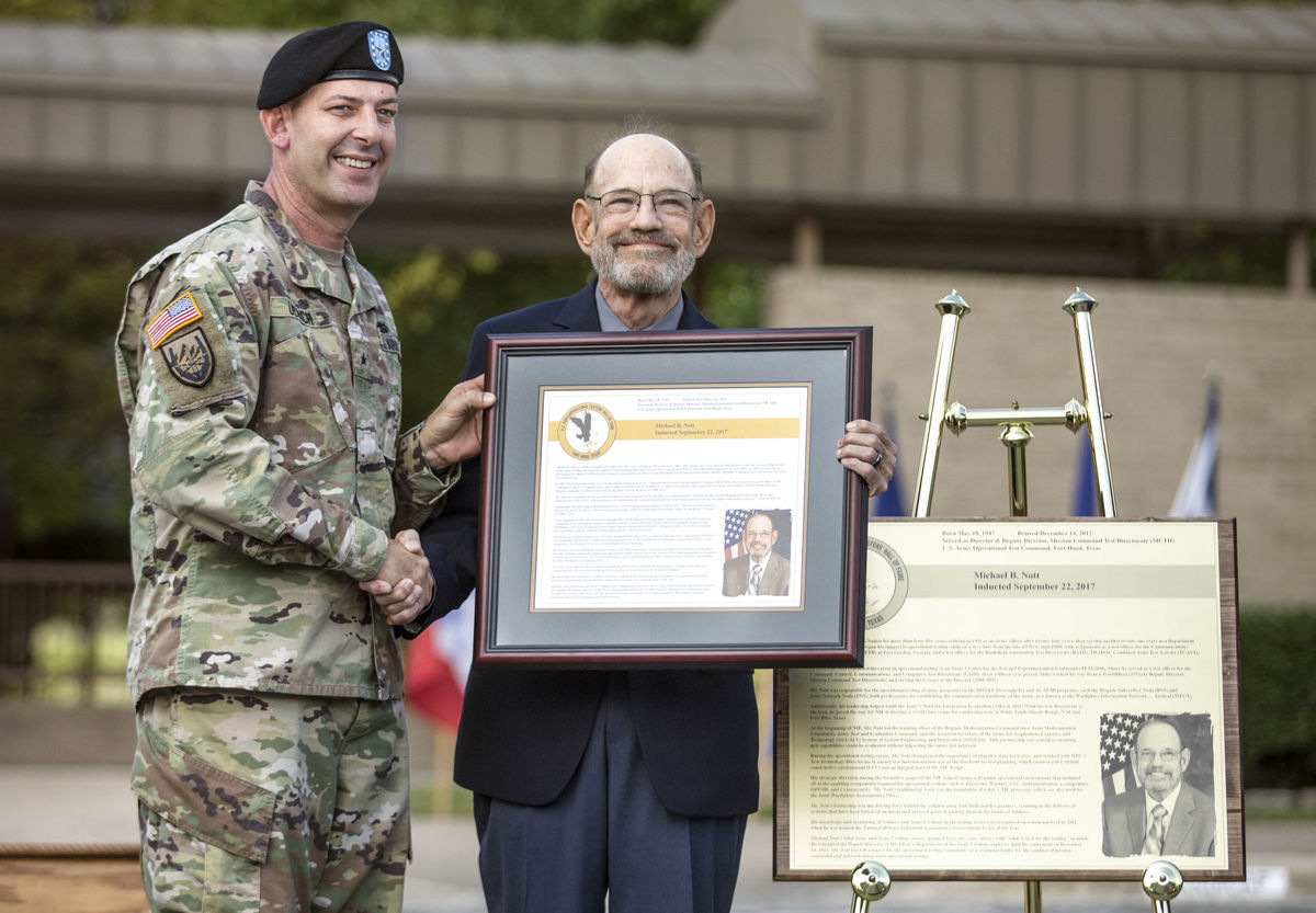 Brig. Gen. John Ulrich, left, inducts Michael B. Nott into the U.S. Army Operational Testers' Hall of Fame during the 24th Annual Induction Ceremony at Fort Hood. (Eric J. Shelton | Herald)