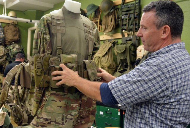 Rich Landry of the U.S. Army Soldier Systems Center laboratories in Natick, Massachusetts, demonstrates key design features included in the Airborne Tactical Assault Panel (ABN-TAP) based on Soldier input.  (Photo Credit: Photo courtesy of Natick Research laboratories)