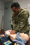 Capt. John A. Escalera, an Operational Test Command Aviation test officer, concentrates on delivering chest compressions during a class on American Heart Association Heartsaver and CPR. During two days, 12 Operational Test Command Soldiers and Army Civilians became qualified in basic life saving techniques. (Photo Credit: Mr. Michael M Novogradac (Hood))
