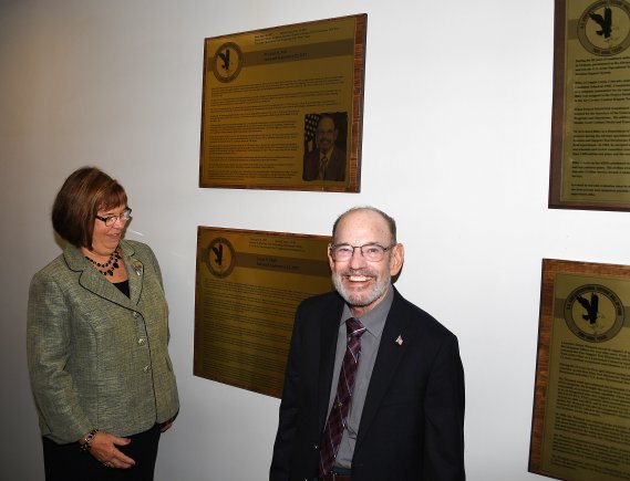Gayle S. Shull (left) and Michael B. Nott are all smiles while viewing plaques honoring their induction into the U.S. Army Operational Test Command's Operational Testers' Hall of Fame Friday. (Photo Credit: Larry Furnace, Operational Test Command Test and Documentation Team)