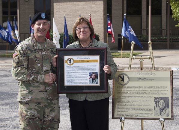 U.S. Army Operational Test Command Commander Brig. Gen John C. Ulrich presents Gayle S. Shull with a framed plaque honoring her induction into the U.S. Army Operational Test Command's Operational Testers' Hall of Fame Friday.  (Photo Credit: Larry Furnace, Operational Test Command Test and Documentation Team)