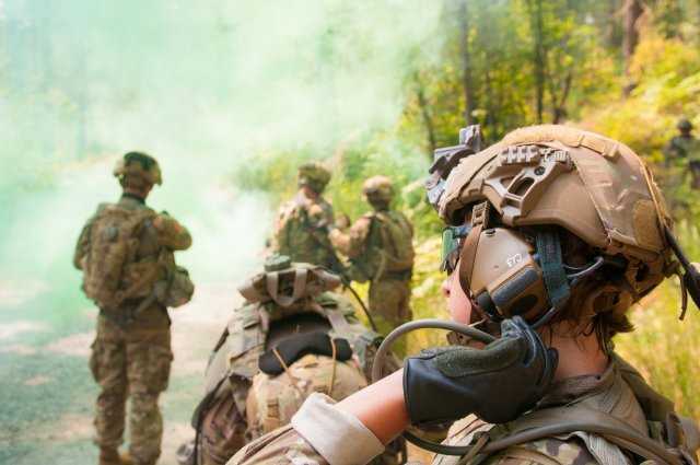 A Soldier reaches for her drink tube