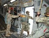 1st Lt. Christopher Lillie, assistant jumpmaster with the 57th Sapper Company, 27th Engineer Battalion, 20th Engineer Brigade, wears the new Integrated Head Protection System (IHPS) helmet with mandible, while shouting commands to position the number one jumper in the door of a C-17 aircraft. (Photo Credit: Barry Fischer, Audio Visual Production Specialist, Airborne and Special Operations Test Directorate, U.S. Army Operational Test Command)