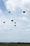 Soldiers from the 57th Sapper Company, 27th Engineer Battalion, 20th Engineer Brigade, descend under the T-11 parachute over Sicily Drop Zone, Fort Bragg, North Carolina, while performing an operational test of the new Integrated Head Protection System (IHPS). (Photo Credit: Jim Finney, Combined Technical Services, Airborne and Special Operations Test Directorate, U.S. Army Operational Test Command)